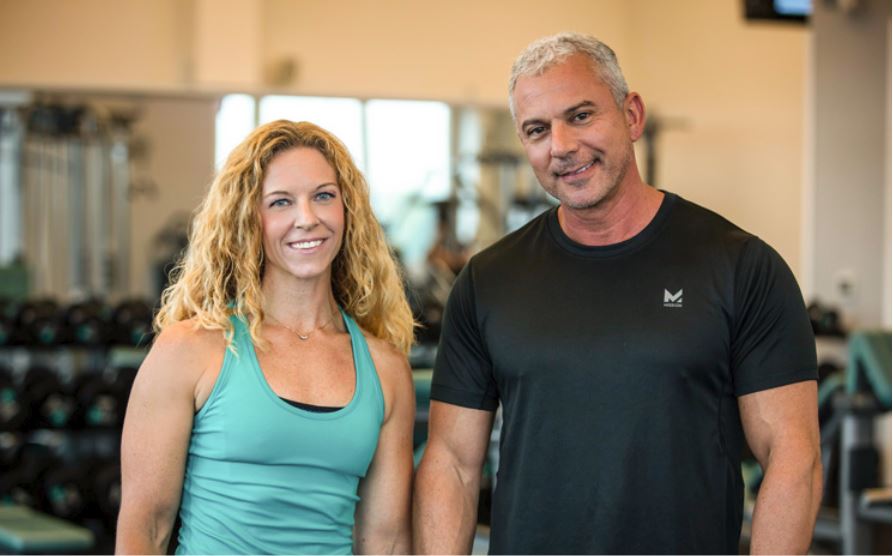 Todd Miller, Live Lean Rx nutritionist, in a black shirt next to his female associate.
